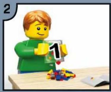 Lego figure in green shirt holding a number 1, with colorful blocks and a wooden table (no text or symbols)