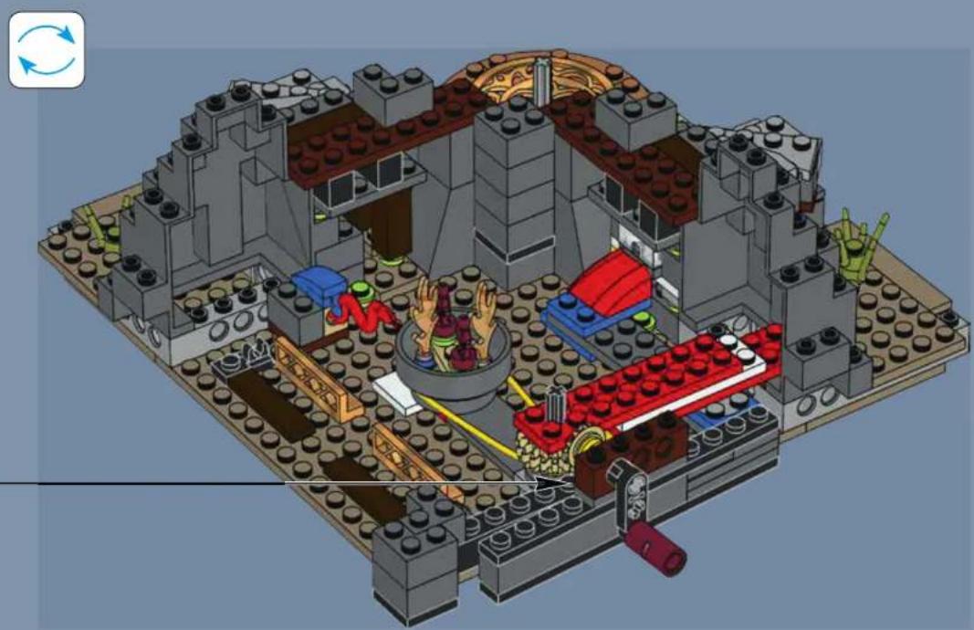 3D architectural model of a LEGO building complex with multiple floors, central seating, and decorative elements (no text or symbols visible)