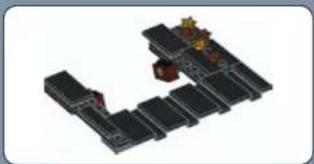 3D architectural model of a building complex with multiple windows and a central tower (no text or symbols visible)