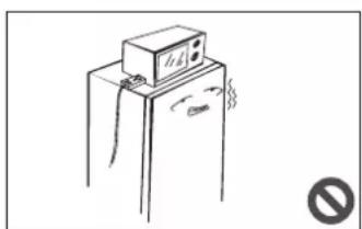Simple line drawing of a refrigerator with a mounted appliance and a circular symbol (no text or labels)