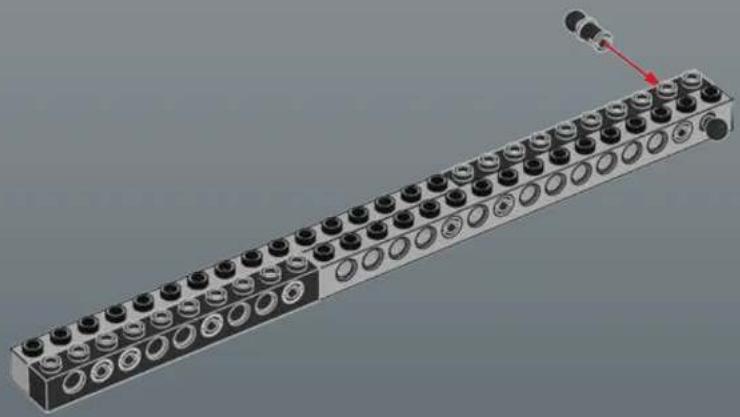 3D rendering of a long industrial conveyor or terminal block with multiple circular components and a red arrow pointing to one end (no text or symbols visible)