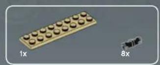 3D illustration of a beige LEGO base with rounded tops, alongside a small black object (no text or symbols)