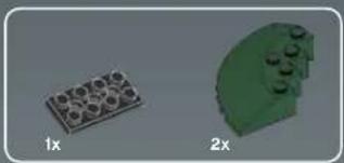 Two 3D-rendered objects: a brown rectangular block labeled '1x' and a green irregular shape with circular elements, both without any text or symbols.