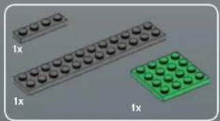 Three LEGO and green LEGO blocks arranged on a gray surface (no text or symbols visible)