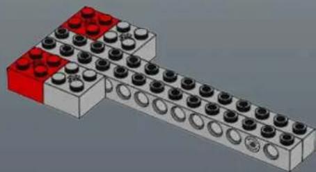 3D diagram of a LEGO structure with red and white blocks arranged in a stepped pattern (no text or symbols)