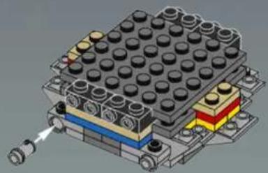3D mechanical assembly diagram showing a multi-tiered LEGO block with no visible text or symbols