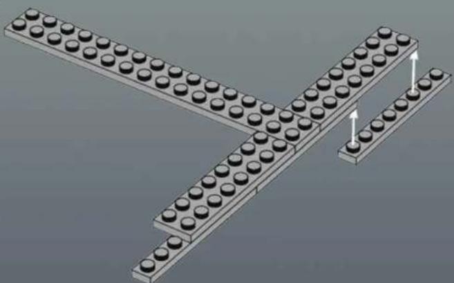 3D diagram of stacked LEGO blocks with circular holes, no text or symbols present