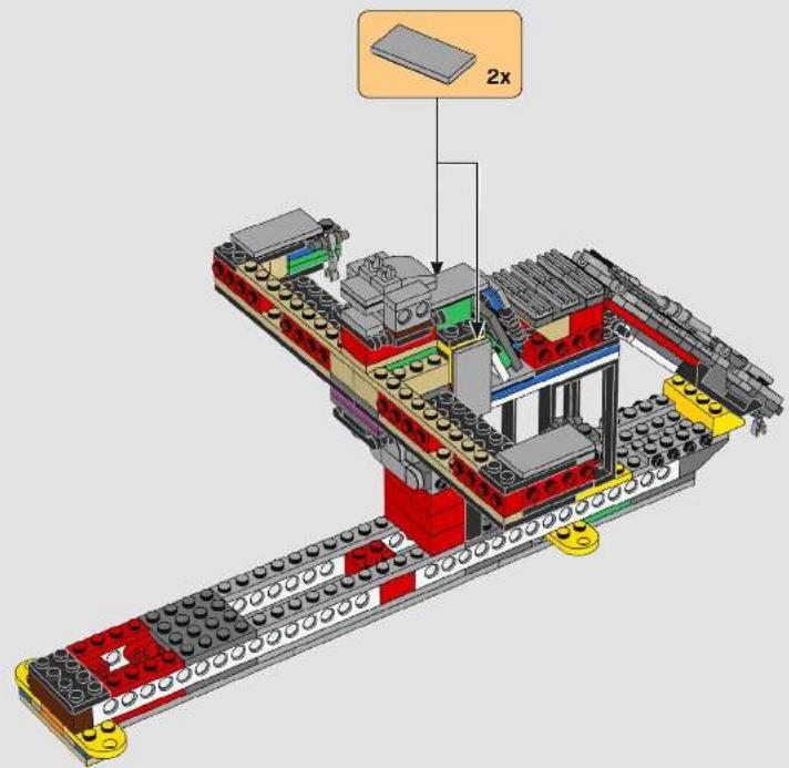 3D diagram of a LEGO building assembly with visible structural components and a 2x load indicator (no text or symbols on the structure itself)