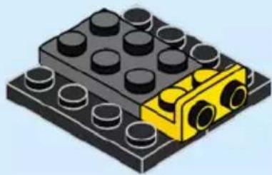 Isometric illustration of a LEGO base with black and yellow components (no text or symbols)