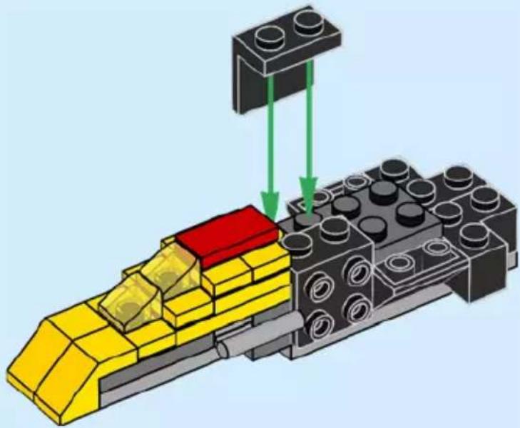 3D diagram of a yellow and black LEGO train with a red block on top, showing green arrows indicating motion or force (no text or symbols)