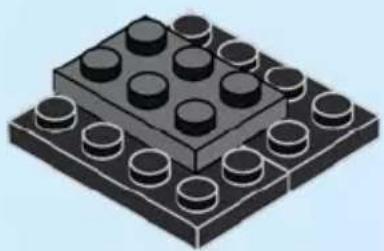Isometric illustration of a LEGO base with multiple circular components (no text or symbols)