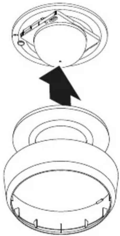 Diagram showing a mechanical assembly with labeled components and an arrow indicating direction of motion or assembly.