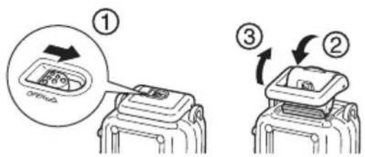 CANON WP-DC26 - 4Deslice el interruptor de liberación del bloqueo como se muestra y suelte el cierre para abrir la cubierta trasera. - 1