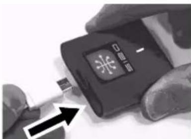 Close-up of hands holding a device with Chinese text and an arrow indicating a process or operation.