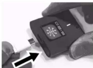 Close-up of hands holding a black USB flash drive with Chinese text and logo, showing a blue LED indicator.