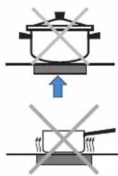 Diagram showing cooking process with a pot and a cooking pan, marked with crossed-out symbols indicating absence or prohibition.
