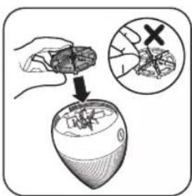 Illustration showing a hand holding a food item being processed into a bowl, with an inset magnifying the process.