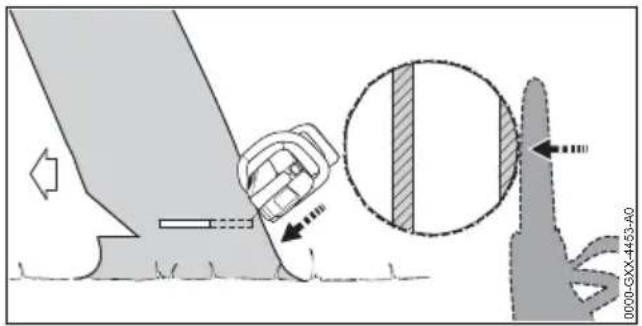 Diagram illustrating a mechanical or electrical process with labeled components and a magnified cross-section showing a shaded area.