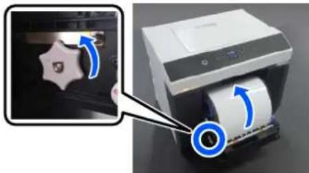 EPSON SureLab SL-D1000 - Tournez la molette sur le côté gauche de l'unité de papier en rouleau dans la direction indiquée par la flèche pour rembobiner le papier rouleau. - 1