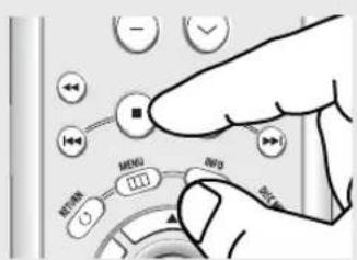 Hand interacting with a device control panel showing buttons, indicators, and a numeric display