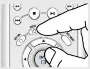 Hand interacting with a control panel showing buttons labeled 'MENU' and 'MENU', with directional arrows indicating action controls.