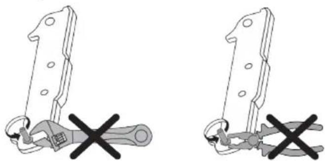 Two identical diagrams showing a wrench being crossed out, with no text or symbols present.