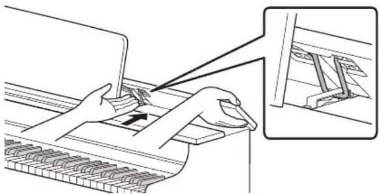 CASIO AP-300 - Abaissez lentement le panneau supérieur tout en poussant vers l'arrière, avec vos doigts, les éléments métalliques qui soutiennent le panneau supérieur. - 1