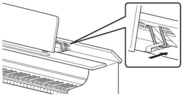 CASIO AP-300 - Abaissez lentement le panneau supérieur tout en poussant vers l'arrière, avec vos doigts, les éléments métalliques qui soutiennent le panneau supérieur. - 2