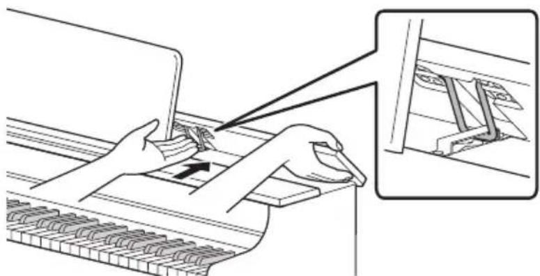 CASIO AP-S200 - Abaissez lentement le panneau supérieur tout en poussant vers l'arrière, avec vos doigts, les éléments métalliques qui soutiennent le panneau supérieur. - 1