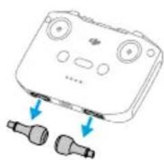 Illustration d'un appareil portable avec deux ports connectés, sans texte ni symboles