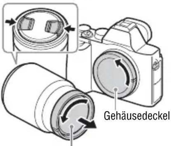 SONY Alpha ILCE-7K - Nehmen Sie den Gehäusedeckel von der Kamera und die Hintere Objektivkappe von der Rückseite des Objektivs ab. - 1
