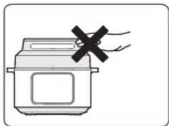 MIDEA MPC602SBMK - En cours de fonctionnement, ne jamais approcher vos mains à proximité des orifices d'échappement. - 2