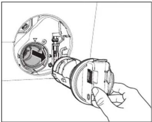 Line drawing of a hand holding a camera lens inside a circular device (no text or symbols)