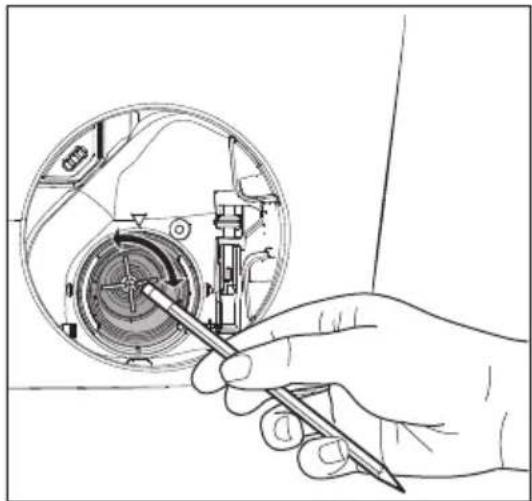 Hand holding a screwdriver inside a mechanical device (no text or symbols visible)