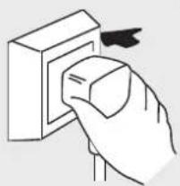 Hand inserting a small block into an electrical outlet (no text or symbols visible)