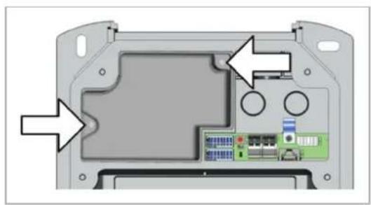 Interior view of a device casing showing internal components and a highlighted area with arrows (no text or symbols)