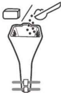 Diagram of a funnel-shaped container with particles being inserted, no text or symbols present