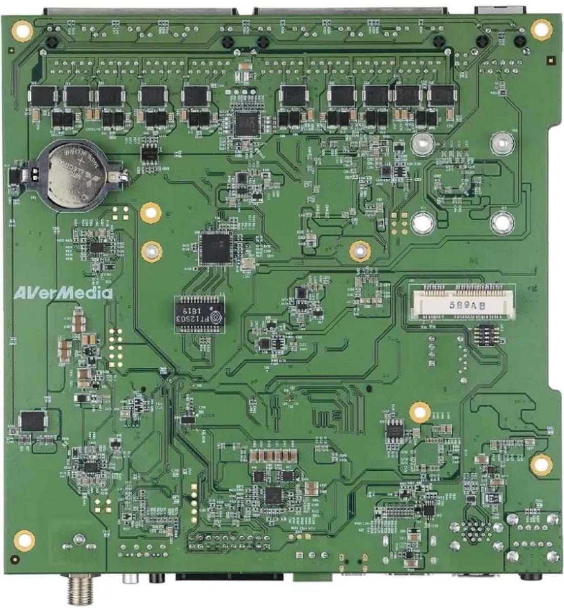 Green printed circuit board with various electronic components and connectors (no readable text or symbols)