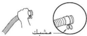 Diagram showing a hand holding a coiled tube with a magnified inset highlighting the cable being held.