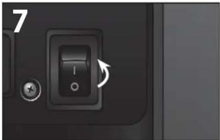Close-up of a black electronic device's left button with an arrow indicating rotation (no text or symbols visible)