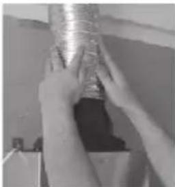 Close-up of hands holding a coiled metal object (no visible text or symbols)