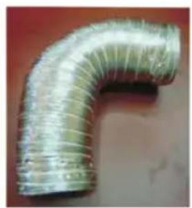 Close-up of a metallic L-shaped pipe fitting with ribbed texture (no text or symbols visible)