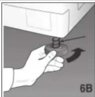 Hand holding a small mechanical component with an arrow indicating rotation (no text or symbols)