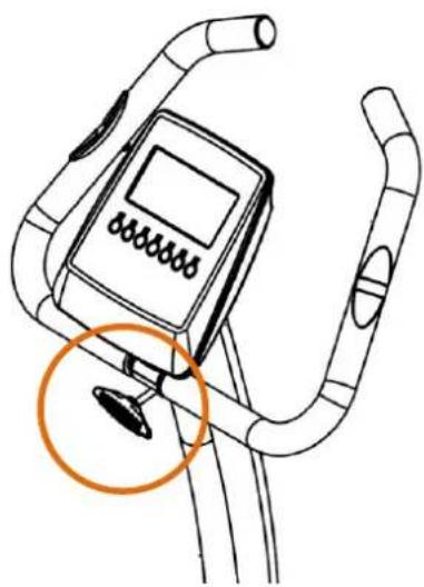 Line drawing of a stationary exercise bike with a digital display and orange circle highlighting the seat area (no text or symbols)
