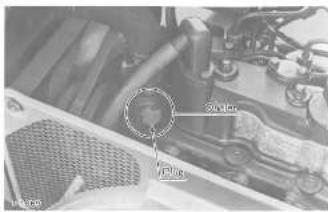 Technical diagram of a car engine bay with labeled components and a highlighted circular component