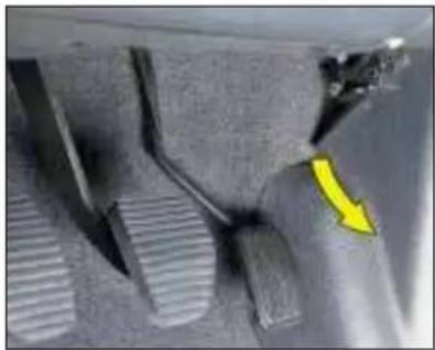 Close-up of a mechanical component with textured surfaces and a yellow arrow pointing to a specific area (no visible text or symbols)