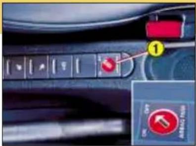 Close-up of a car dashboard control panel with labeled buttons and a highlighted red button labeled 'OK' and 'CHANGE'