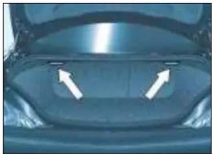 Close-up of a car's front bumper with two white arrows pointing to the side (no text or symbols visible)