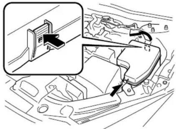 Diagram showing car interior components with a magnified view of a device panel and directional arrows indicating movement or assembly.