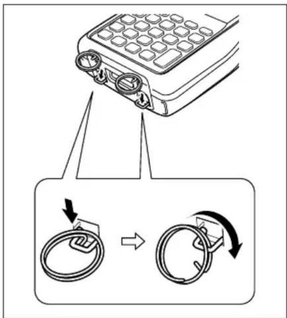 Diagram showing a device with labeled parts and directional arrows indicating rotation or adjustment.
